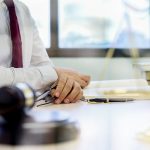 Judge gavel with Justice lawyers having team meeting at law firm