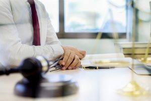 Judge gavel with Justice lawyers having team meeting at law firm