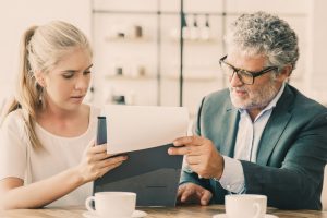 Mature legal advisor reading document